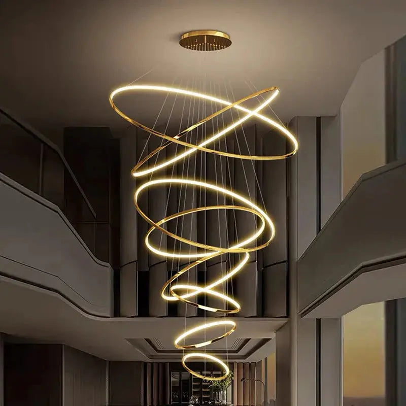 Nordic home decoration stair chandelier with spiral LED rings, ideal for high-ceiling living rooms and modern indoor lighting design.