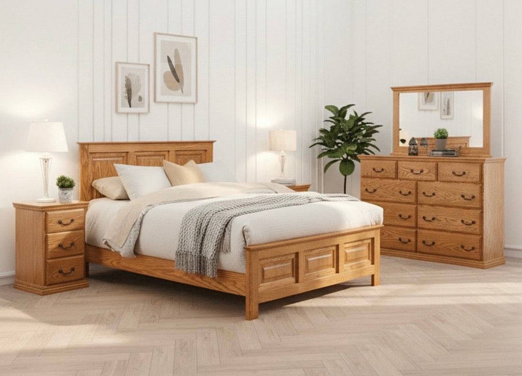 Traditional Oak Eastern KING O-T470-EK Bedroom Set in a minimalist white room, featuring solid oak furniture with elegant panel detailing and ample storage.