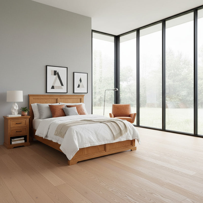 Dublin D470 Solid 5 Piece Oak Rail Bed in a minimalist bedroom with floor-to-ceiling windows. Features clean lines and solid oak craftsmanship.