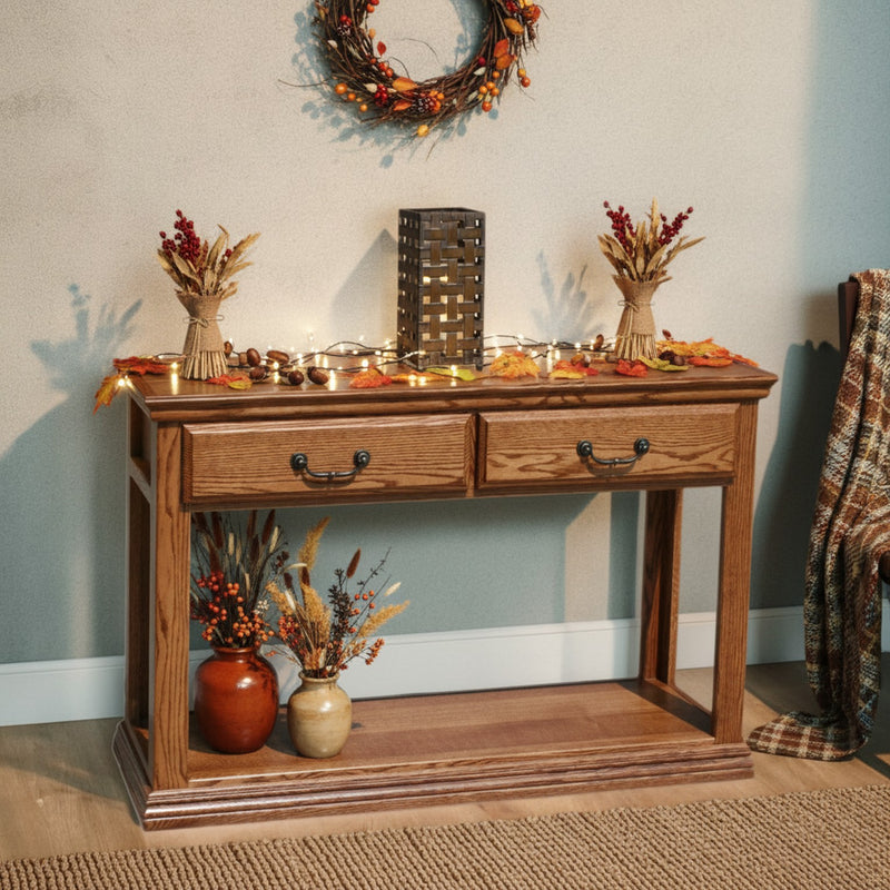 Traditional Oak Sofa Console Table O-T247 styled with fall decor, featuring two full-extension drawers and fixed shelf in a cozy seasonal setting.