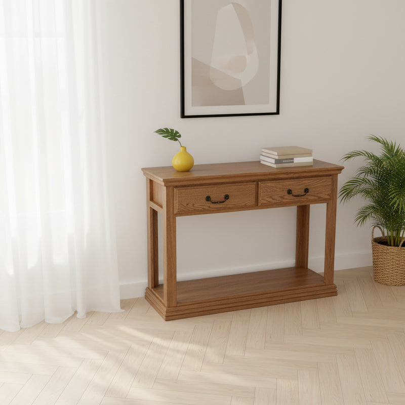 Traditional Oak Sofa Console Table O-T247 in a bright minimalist room with natural light, featuring two drawers and a spacious lower shelf.