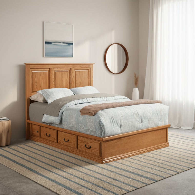 Traditional T456 Low Pedestal Platform bed in oak wood with storage drawers, styled in a bright bedroom with striped rug and round mirror.