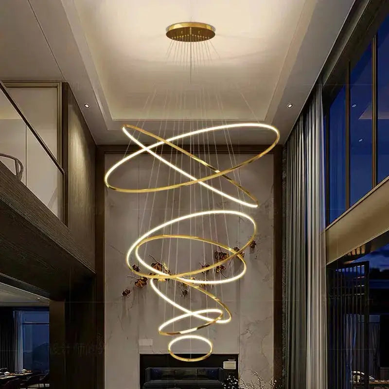 Gold spiral LED pendant light for Nordic home decor, perfect for high-ceiling living rooms and staircases with modern aesthetics.