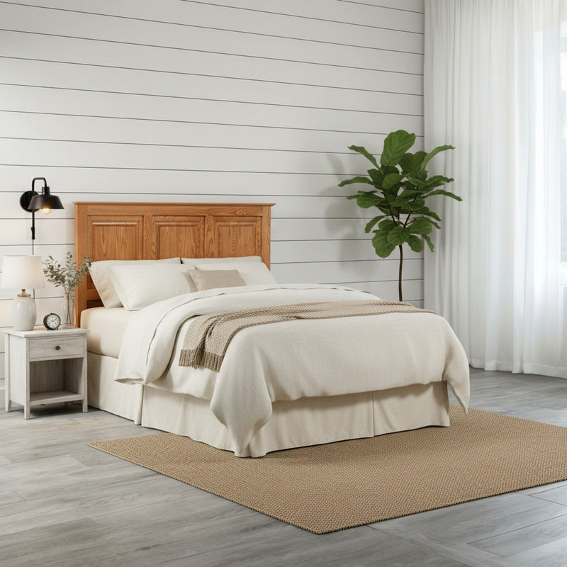 Traditional T471 Solid Oak Flat Panel Headboard ONLY in a minimalist bedroom with light wood flooring and a potted plant for a natural touch.